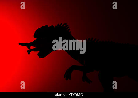 allosaurus shadow with red light in dark Stock Photo - Alamy