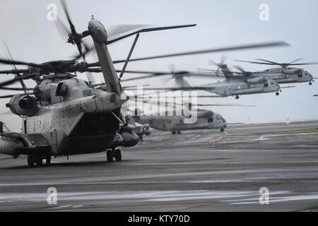 U.S. Marine Corps CH-53E Super Stallion helicopters take off from the Marine Corps Air Station Kaneohe Bay December 20, 2017 in Honolulu, Hawaii.