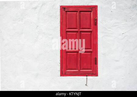 red window on white wall Stock Photo