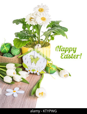 White tulips, gerberas and Easter eggs on wood isolated on white. Space for your text Stock Photo