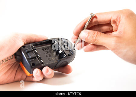 communication electrical equipment repair with hand of engineer on white or isolate background Stock Photo