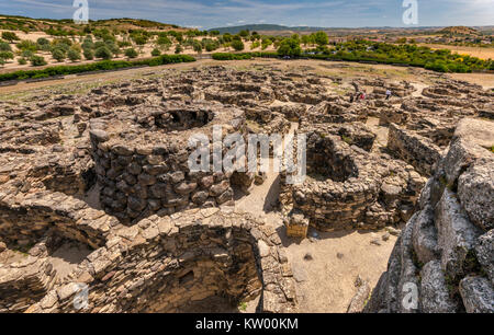 Ruins of village at Nuraghe Su Nuraxi, 13-6th century BC, late Bronze Age megalithic structure, near Barumini, Sardinia, Italy Stock Photo