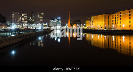 Liverpool, England, UK - November 4, 2014: The pump house and warehouses of the historic Albert Dock complex are reflected in Canning Dock in Liverpoo