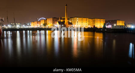 Liverpool, England, UK - November 4, 2014: The pump house and warehouses of the historic Albert Dock complex are reflected in Canning Dock in Liverpoo