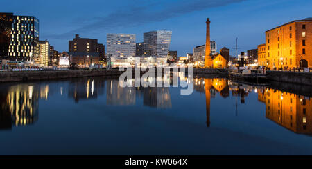 Liverpool, England, UK - November 8, 2017: Old industrial warehouses and modern office buildings are reflected in the waters of Canning Dock in Liverp