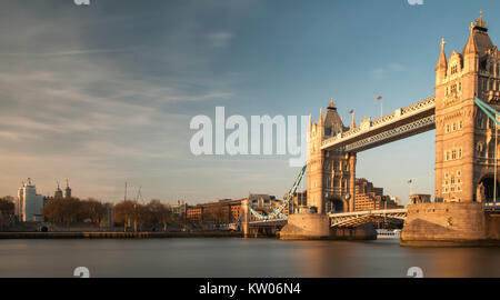 London, England, UK - April 23, 2010: London's iconic Tower Bridge is lit up by warm evening light beside the Tower of London. Stock Photo