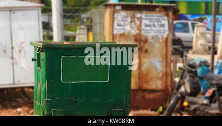 opened green garbage container in outside. Stock Photo