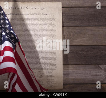 Declaration of independence with United States flag on a wood background Stock Photo