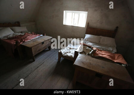 Bedroom in an old building at the Weald & Downland Open Air Museum Singleton, Chichester, West Sussex, UK. Stock Photo