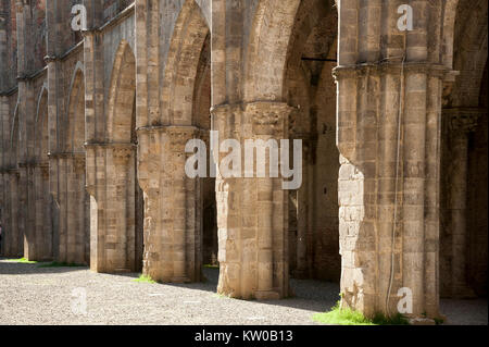 Ruined Italian Gothic Abbazia di San Galgano (Abbey of San Galgano) from XIII century was one of the richest and most powerful monasteries in XIII and Stock Photo