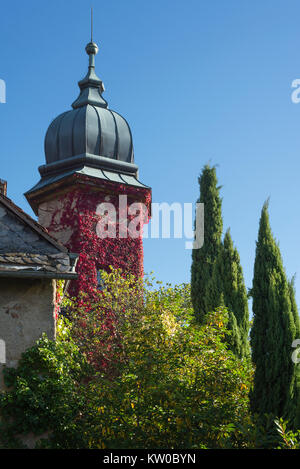 Fairytale castle tower from the romantic New Castle in Baden-Baden overgrown with autumn leaves, Baden-Wuerttemberg, Germany Stock Photo