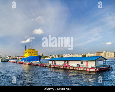 Icebreaker diesel near the pier on the Neva River in the city of St. Petersburg on a summer sunny day next to the passenger terminal Stock Photo