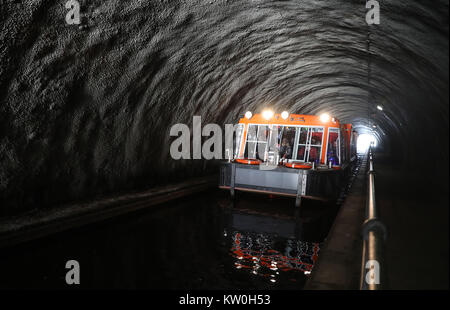 The canal boat Archimedes passes through the Rough Castle tunnel on the Union canal near the Falkirk Wheel as the cold weather continues. Stock Photo