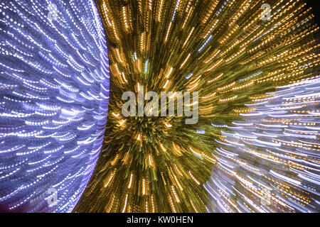 Background. Texture. Blurred colorful Christmas lights background over dark background with library. Abstraction. Stock Photo