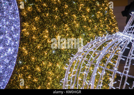 Background. Texture. Blurred colorful Christmas lights background over dark background with library. Abstraction. Stock Photo