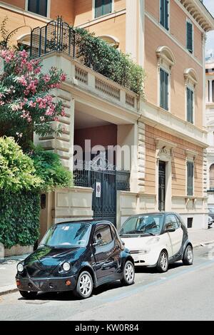 Mini cars seen throughout Italy and Rome. Efficient small vehicles help offset the high cost of fuel. In vogue are electric vehicles now the rage among environmentalists. Stock Photo