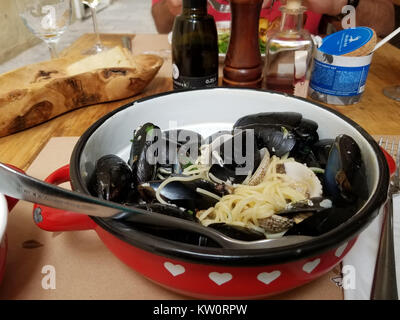 Black mussels steamed with pasta ready to eat and eaten Stock Photo