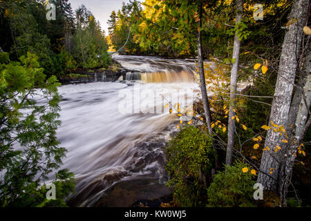 Autumn Wilderness Waterfall Background. Lower Tahquamenon Falls during peak fall foliage at Tahquamenon Falls State Park. Upper Peninsula, Michigan Stock Photo