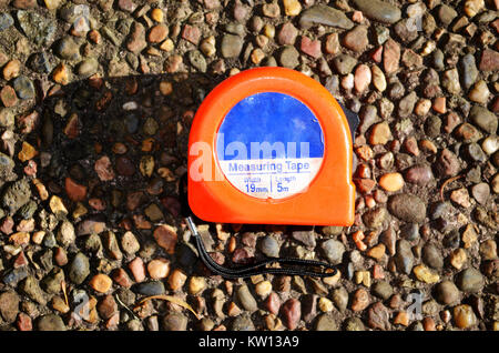 Close up of measuring tape on the ground Stock Photo