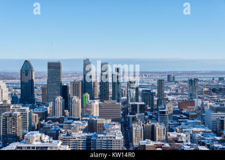 Montreal, CA - 26 December 2017: Montreal Skyline from Kondiaronk belvedere in winter after snowstorm. Stock Photo