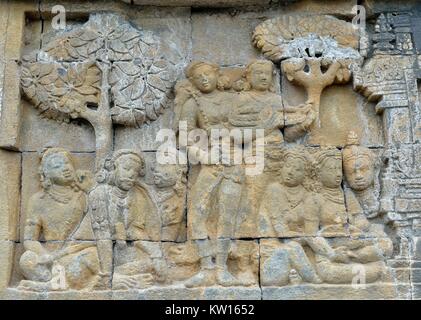 Detail of Buddhist carved relief in Borobudur temple in Yogyakarta, Java, Indonesia.. Stock Photo