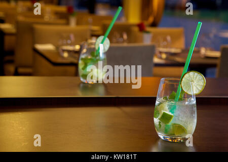 Mojito cocktail on wooden table at a cafe blurred background Stock Photo