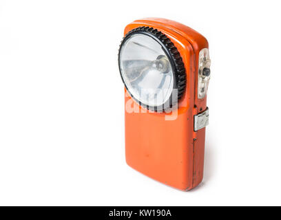 Old battery flashlight on the white background Stock Photo