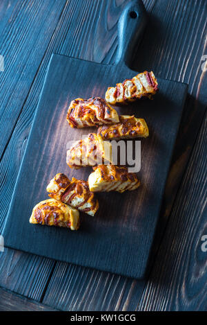 Pizza rolls on the wooden board Stock Photo