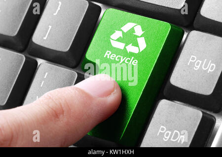 Green recycle button on the keyboard Stock Photo