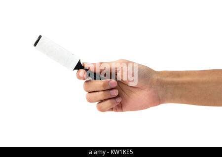 Hand holding sticky roller for removing animal hair, dust, and hair brushes Stock Photo