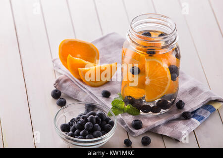 fresh fruit Flavored infused water mix of orange, blueberry and  Stock Photo