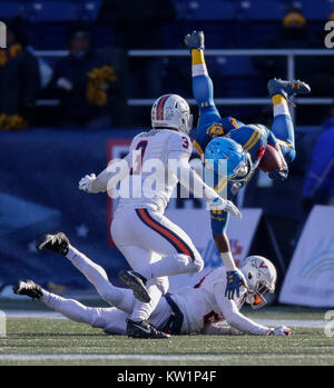 Annapolis, MD, USA. 28th Dec, 2017. Navy Midshipmen SB #28 Josh Brown is upended during the Military Bowl between the University of Virginia Cavaliers and the United States Naval Academy Midshipmen at Navy Marine Corps Memorial Stadium in Annapolis, MD. Justin Cooper/CSM/Alamy Live News Stock Photo