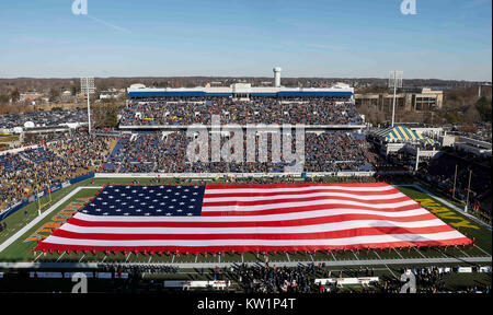 Annapolis, MD, USA. 28th Dec, 2017. A large American Flag covers the field before the Military Bowl between the University of Virginia Cavaliers and the United States Naval Academy Midshipmen at Navy Marine Corps Memorial Stadium in Annapolis, MD. Justin Cooper/CSM/Alamy Live News Stock Photo