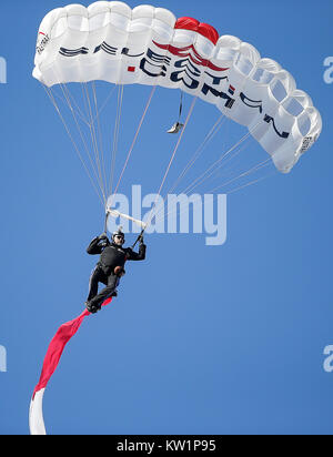 Annapolis, MD, USA. 28th Dec, 2017. Skydivers jump into the stadium before the Military Bowl between the University of Virginia Cavaliers and the United States Naval Academy Midshipmen at Navy Marine Corps Memorial Stadium in Annapolis, MD. Justin Cooper/CSM/Alamy Live News Stock Photo