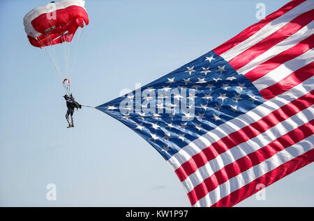 Annapolis, MD, USA. 28th Dec, 2017. Skydivers jump into the stadium with the American flag before the Military Bowl between the University of Virginia Cavaliers and the United States Naval Academy Midshipmen at Navy Marine Corps Memorial Stadium in Annapolis, MD. Justin Cooper/CSM/Alamy Live News Stock Photo