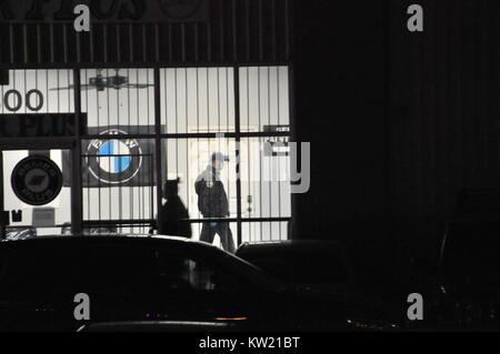 Houston, USA. 29th Dec, 2017. Local policemen investigate at the scene of the shooting in southwest Houston, Texas, the United States of America, Dec. 29, 2017. Houston police confirmed Friday evening that three people, including the gunman, were killed in a shooting incident in southwest Houston, the U.S. state of Texas. Credit: Liu Liwei/Xinhua/Alamy Live News Stock Photo