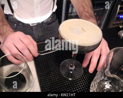 New York, USA. 28th Dec, 2017. The cocktail 'Around Midnight' made out of activated carbon is presented on the bar 'Clay' in New York, USA, 28 December 2017. Credit: Johannes Schmitt-Tegge/dpa/Alamy Live News Stock Photo