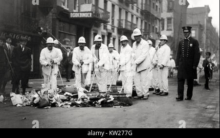 'White Wings' under police protection - Photo shows men dressed in white uniforms and hats sweeping garbage in the streets, during a New York City garbage strike, Nov. 8-11, 1911.