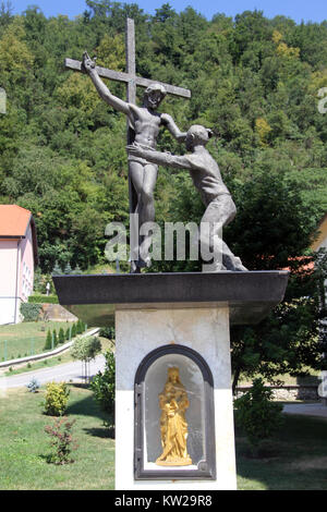 Bronze monument with crucifix in Croatia Stock Photo