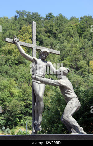 Bronze crucifixion near forest in Croatia Stock Photo