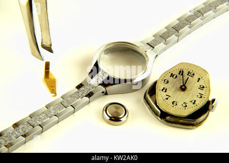 Battery change on an old clock Stock Photo