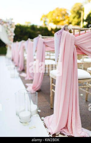 Rows of chairs for the guests at a wedding ceremony. Stock Photo
