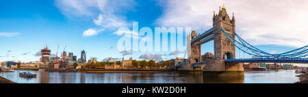 Panoramic London skyline with iconic symbol, the Tower Bridge and Her Majesty's Royal Palace and Fortress, known as the Tower of London as viewed from Stock Photo