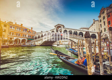 Panoramic view of famous Canal Grande with famous Rialto Bridge at sunset in Venice, Italy with retro vintage Instagram style filter effect Stock Photo