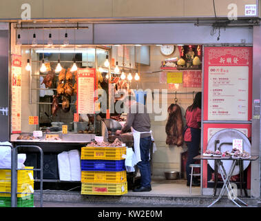 Small street shop selling Cantonese style barbecued pork and poultry, Hong Kong. Stock Photo