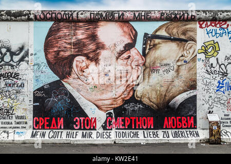 BERLIN, GERMANY - JULY 12: Street art graffiti painting 'The Kiss' by Dmitri Vrubel at famous East Side Gallery, the longest preserved section of the 