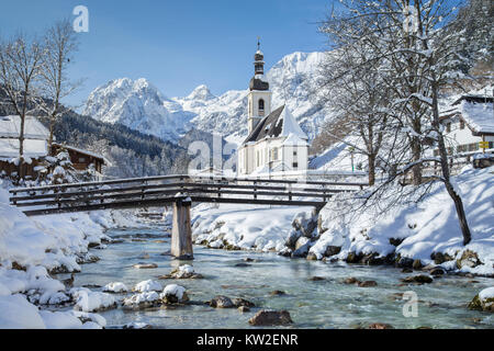 Panoramic view of scenic winter landscape in the Bavarian Alps with famous Parish Church of St. Sebastian in the village of Ramsau, Nationalpark Berch Stock Photo