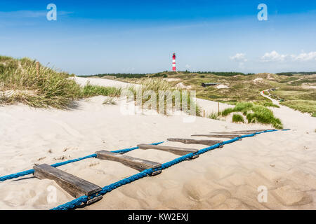 Beautiful dune landscape with traditional lighthouse at North Sea, Schleswig-Holstein, Germany Stock Photo