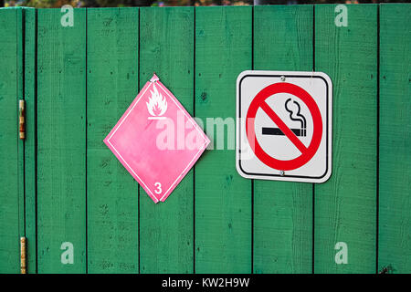 No smoking next to a flammable category 3 hazard sign. Stock Photo
