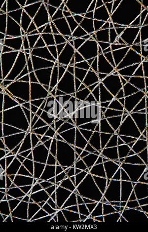 Chaotic weave of silver threads on black, abstract background Stock Photo